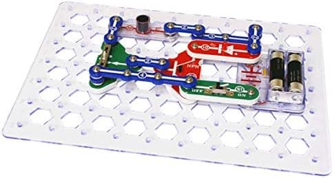 Snap Circuits Classic PLUS SC-310 parts laid out showing the range of snap-together modules, motor, speaker and snap wires included in the kit