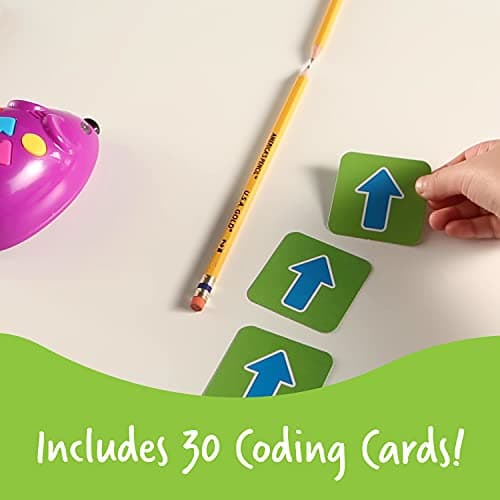 Set of Code & Go coding cards showing directional arrows laid out next to a pencil for scale