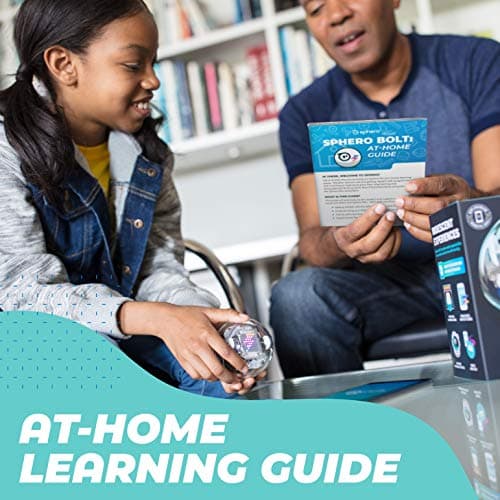 Parent and child with a Sphero BOLT and the printed at-home learning guide