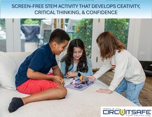 Child building a Snap Circuits Arcade game circuit on the baseplate with the LED scoreboard lit up