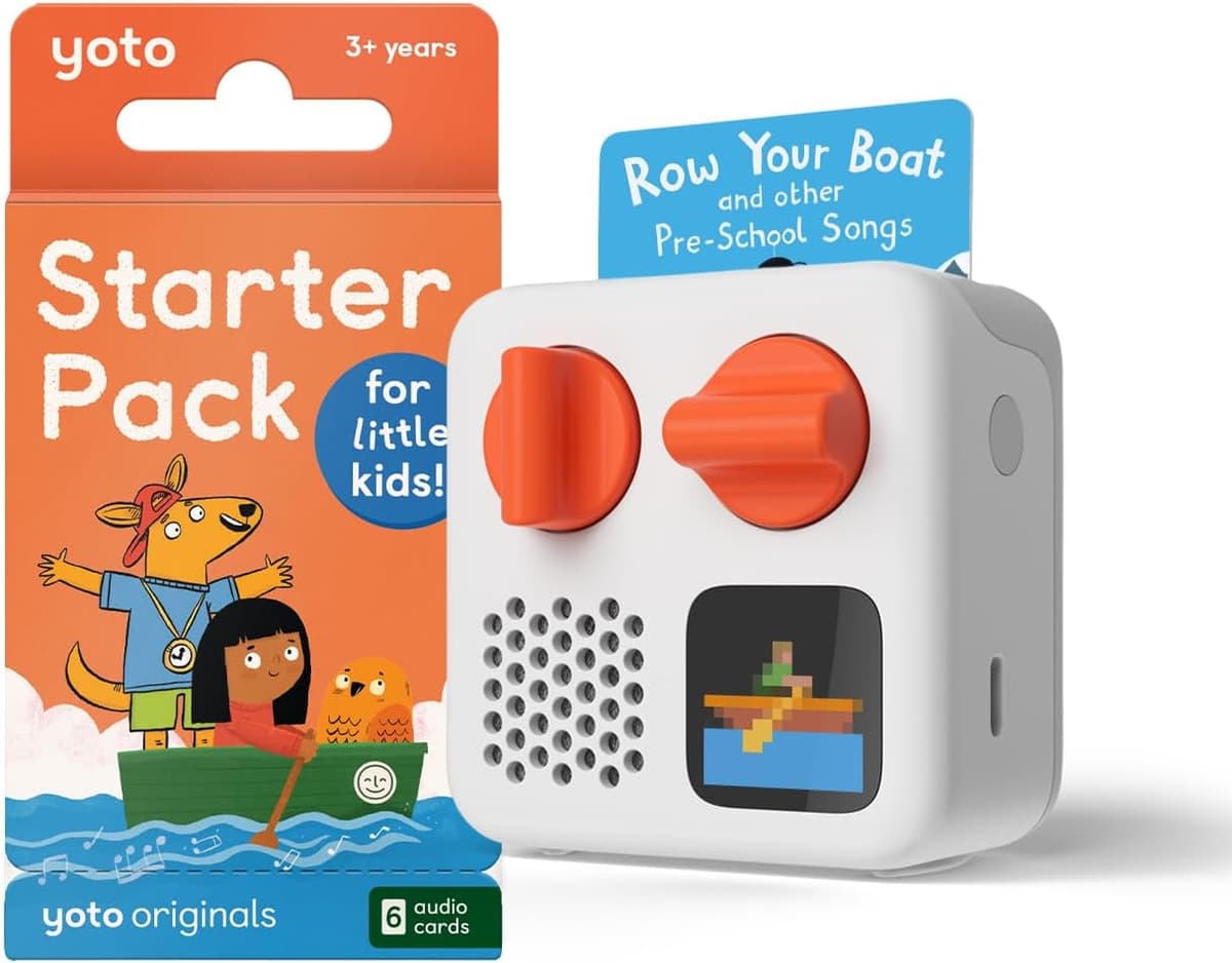 Yoto Mini 2024 audio player in white with orange dials, a Row Your Boat card inserted, and the Little Kids starter pack box marked 3+ years