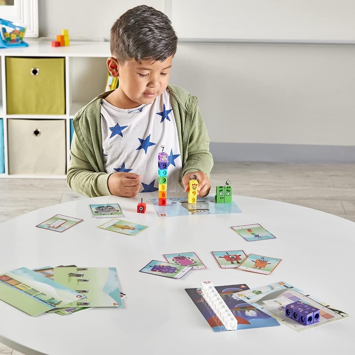 Numberblocks activity cards and cubes laid out for a counting activity